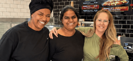 Restaurant team members smiling together.